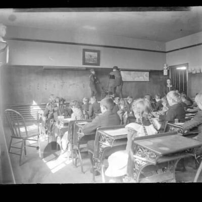 Classroom of younger students watching enactment