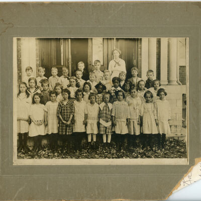 First and second grade students standing in front of Red Hook School #4