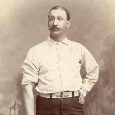 Johnston Livingston de Peyster with tennis racket