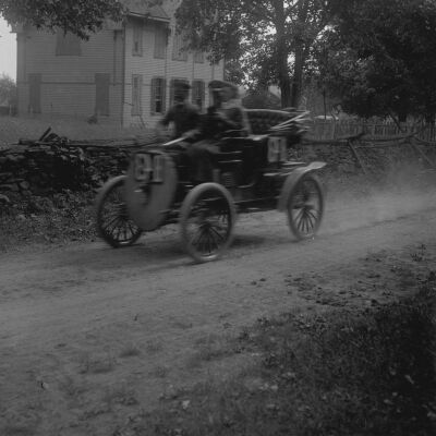 Auto driving by school building, Upper Red Hook