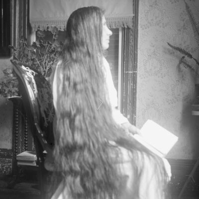 Nena Teator, seated with long hair down