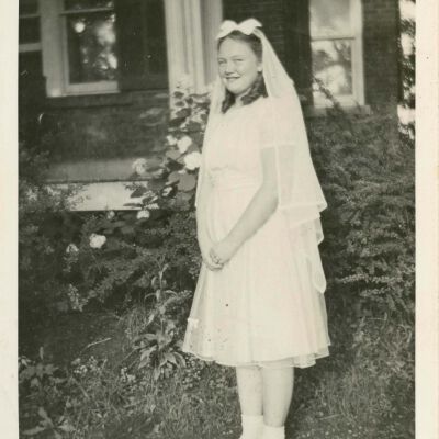 M. Doty, dressed for her first communion.