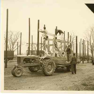 Workers hammering side support