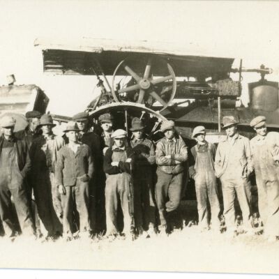 Workers in front of Rumely Oil Pull