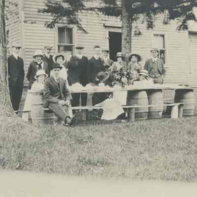 Mead family seated outside at table