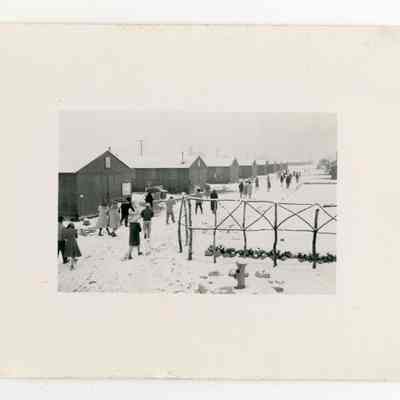 People leaving Buddhist church, winter, Manzanar Relocation Center, California