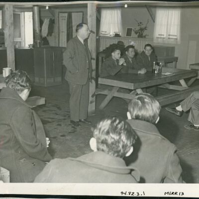 A meeting was held in one of the mess halls to explain to Japanese and Japanese Americans the purpose of