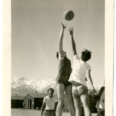 Photograph of tip off for a boys basketball game at Manzanar