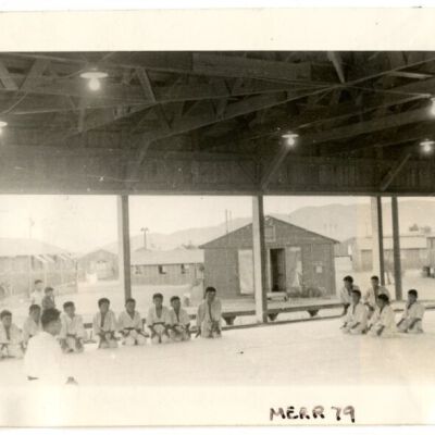 Photograph of young boys kneeling on dojo floor at Manzanar