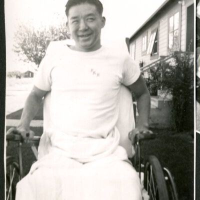 Photograph of Peter Hondo in a wheelchair at Manzanar