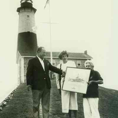 Peg Winski giving drawing by Frank Borth to Virgil Conway, 1987 | Frank and Barbara Borth Collection, Montauk Library Archives