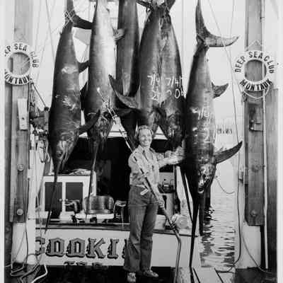 Angler pictured with her catch aboard the vessel Cookie, c. 1960s | Judy and Bob Darenberg Photograph Collection, Montauk Library Archives