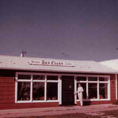 [Photograph of Sibyl Tuma in front of her shop Sea Chest Antiques, 1964–1967]