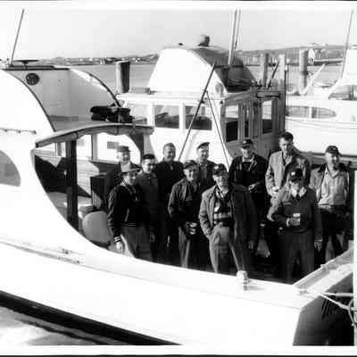 Captains going to Rhode Island to get their captain's licenses: Harry Clemenz Sr., Harry Clemenz, Jr., Bob Tuma, George McTurk, Bob Fitzgerald, Charlie Kaiser, Ralph Pitts, Vinnie Grimes, Joe (?), and Clancy Pitts. April 24, 1958 | Bob Tuma Digital Album, Montauk Library Archives