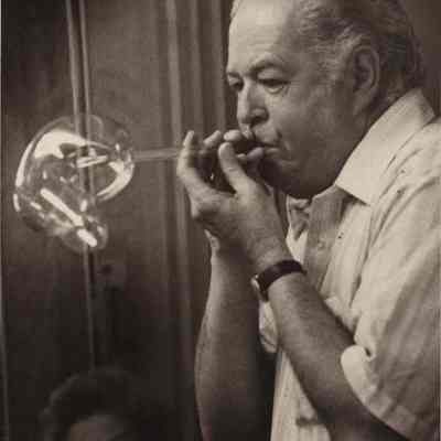 A photo view of Herbert Merrill demonstrating glass blowing. 2/19/1981.