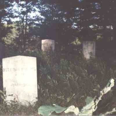 A photo of some tombstones. 9/1986