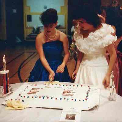 Heather Wilkes cutting the cake