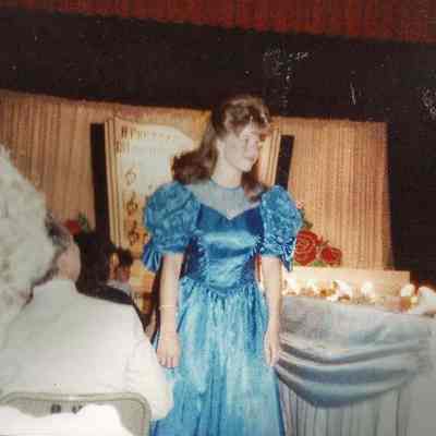 Lisa Kelly giving a rose to her parents.