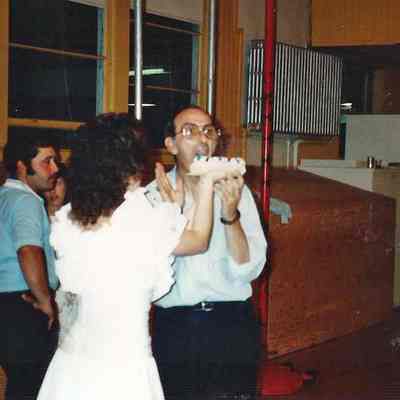 Chressie Gagne feeding cake to Gene Gagne