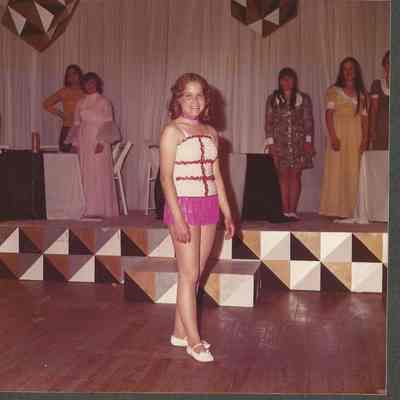 Contestant #1 Bernadette Menard possing in her talent costume.