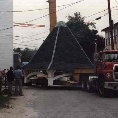 A photo view of moving the top of a church steeple. 12/10/1990.