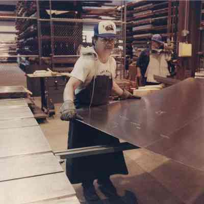A photo view of sheet metal workers, working. 5/16/1990.