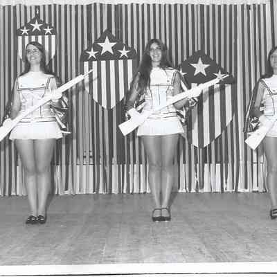 A B/W photograph of the contestant posing in costume