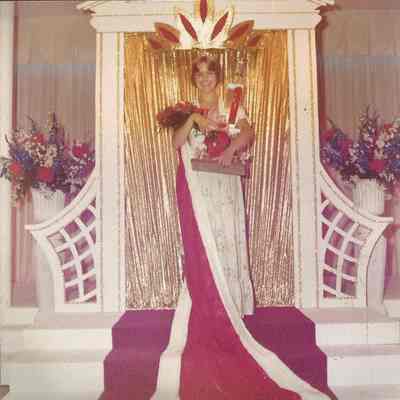Becky holding her trophy and carnations