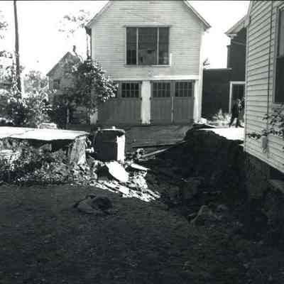 A photo of a washout on Winter St Topsham during Hurricane Edna. 9/12/1954