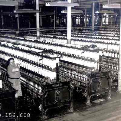 Mrs. Louise Gaudreau at work in the Spinning Room at the Verney Mill