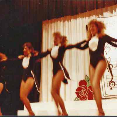 The contestants finishing up the opening number with a kickline.