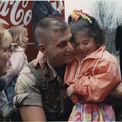 A photo view of a man with his daughter, 4/17/1991.