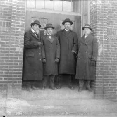 A group of men standing.