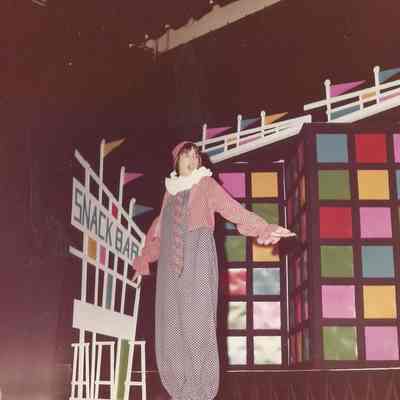 Contestant #1 Christine Arey is performing a mime to the song "Send in the Clowns" made popular by Judy Collins.