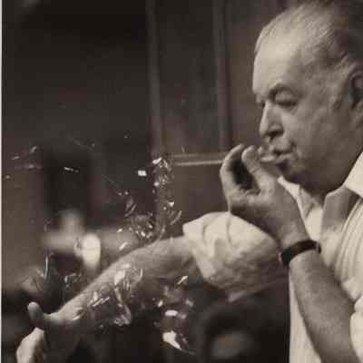 A photo view of Herbert Merrill blowing glass. 4/17/1978.