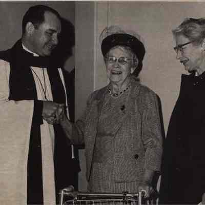 A photo view of three people.