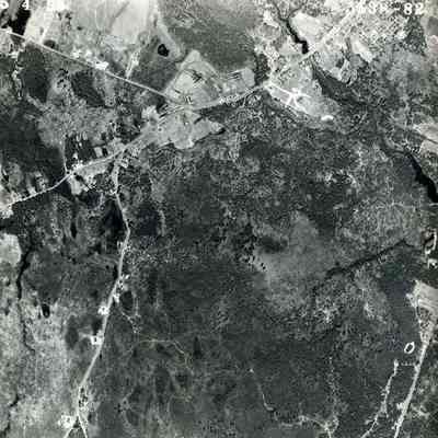 A B/W aerial photograph of an area near around First Parish Cemetery. 5/4/1953.