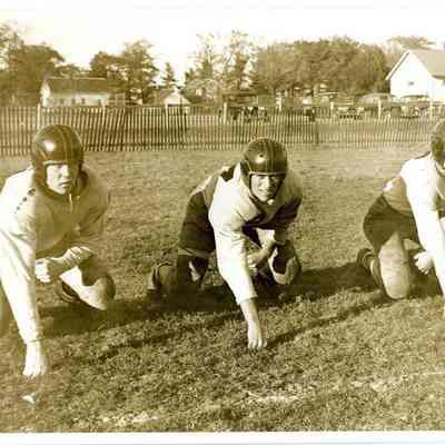 Three Boys Playing Football