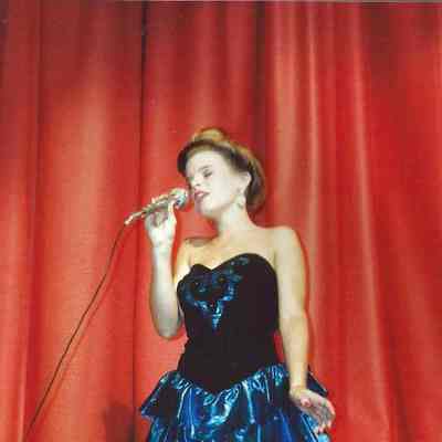 Kimberly Welch singing "Amazing Grace".