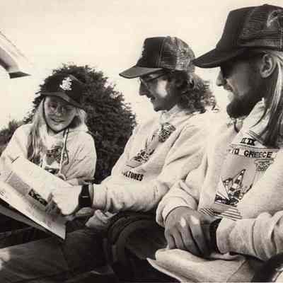 A photo view of three people. 5/19/1992.