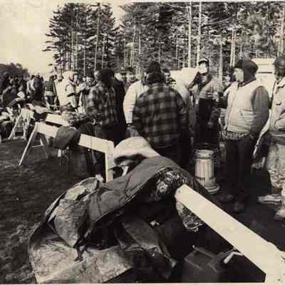 A photo view of people lined up for a claming license. 4/1/1992.
