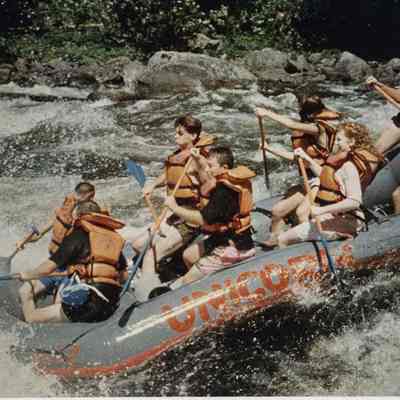 A photo view of a group white water rafting. 7/15/1991