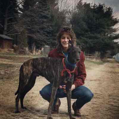 A photo view of a lady with a dog. 4/6/1989.