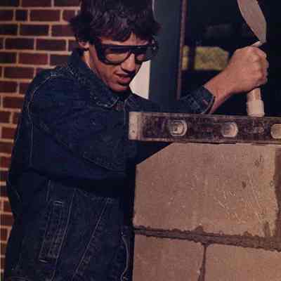 A photo view of a bricklayer at work. 10/25/1988.