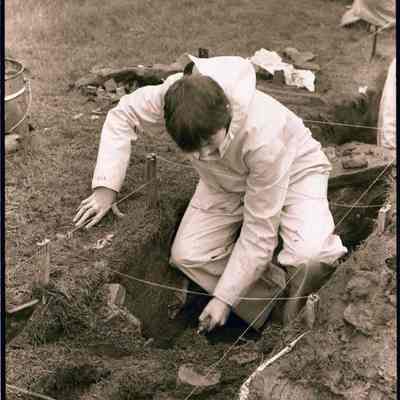 A photo view of a student at an archeological dig. 5/1979.