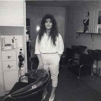 A photo view of a woman in "Hairs to Go", shop. 6/16/1992.