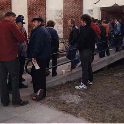 A photo view of people in a line.