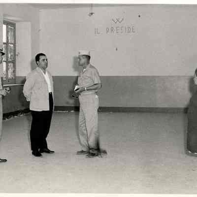 Two Navy Men in an Empty Room