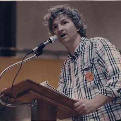 A photo view of a man speaking. 5/27/1992.