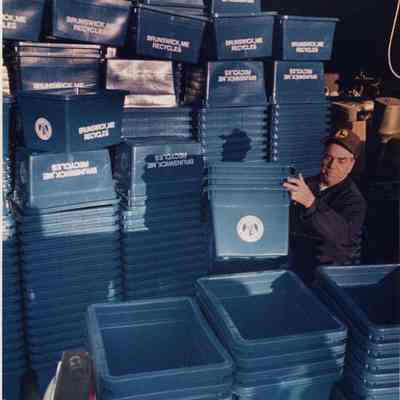 A photo view of a worker getting ready to distribute containers.12/20/1988.
